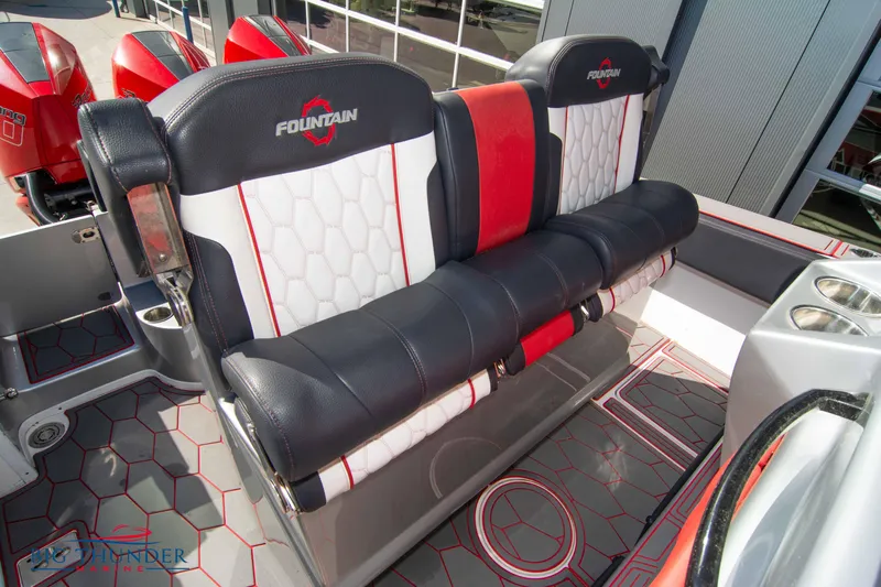  Yacht Photos Pics 2021 Fountain 38 SC boat seats with red, white, and black upholstery.