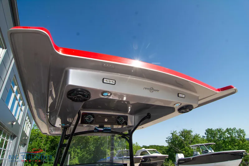  Yacht Photos Pics 2021 Fountain 38 SC boat with red and white T-top under clear blue sky.