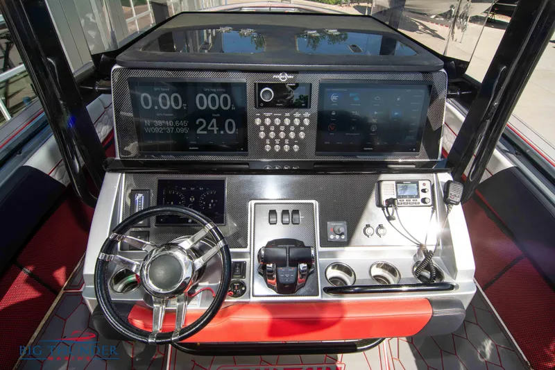  Yacht Photos Pics 2021 Fountain 38 SC boat dashboard with advanced navigation and control systems.
