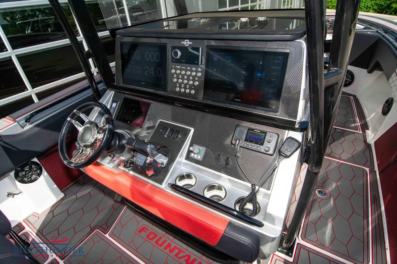  Yacht Photos Pics 2021 Fountain 38 SC boat dashboard with advanced navigation system and modern controls.
