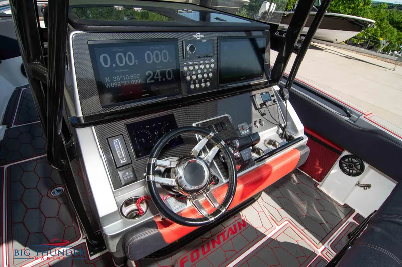  Yacht Photos Pics 2021 Fountain 38 SC boat dashboard with advanced navigation and control systems.