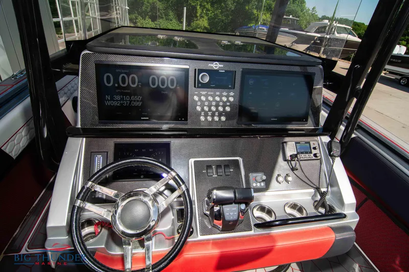  Yacht Photos Pics 2021 Fountain 38 SC boat dashboard with advanced navigation and control systems.