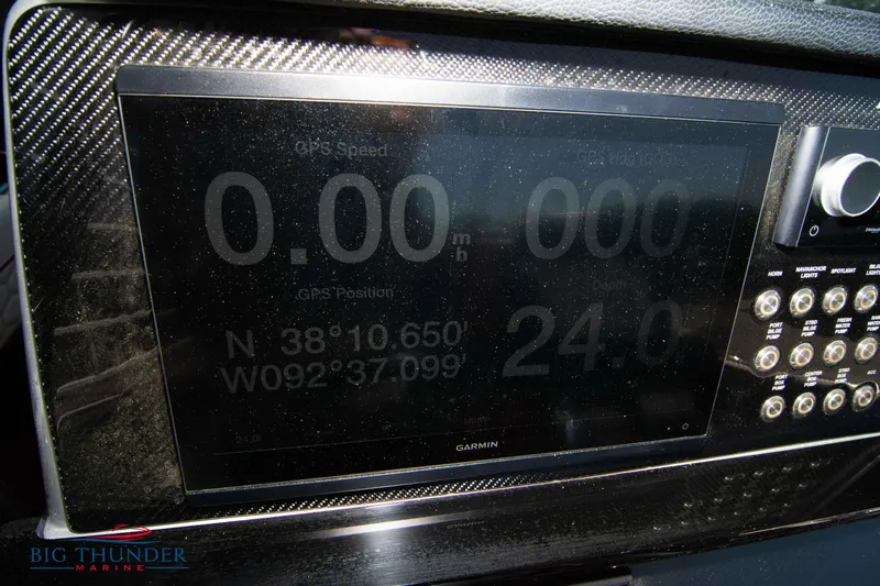  Yacht Photos Pics Dashboard of a 2021 Fountain 38 SC boat showing GPS coordinates and speed.