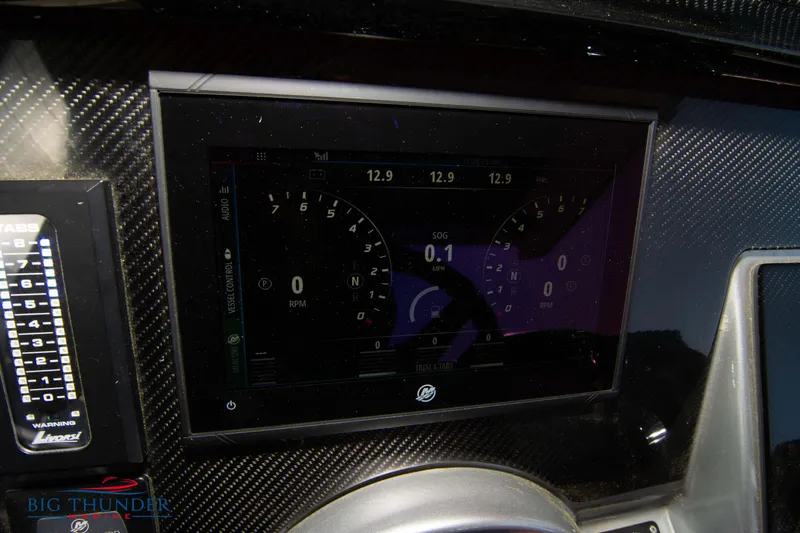  Yacht Photos Pics Dashboard of a 2021 Fountain 38 SC boat with digital display and controls.