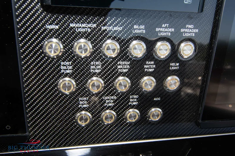  Yacht Photos Pics Control panel of a 2021 Fountain 38 SC boat with various labeled switches.