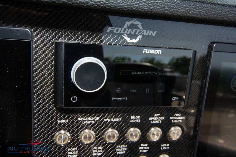  Yacht Photos Pics Fountain 38 SC 2021 dashboard with Fusion audio system and control panel.