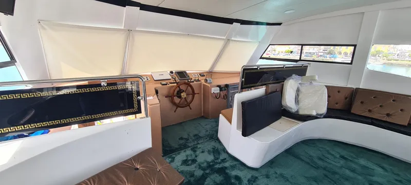  Yacht Photos Pics Luxurious 2021 Jetcraft passenger boat interior with plush seating and modern helm.