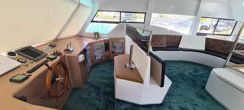  Yacht Photos Pics Luxurious Jetcraft passenger boat interior with modern helm, plush seating, and panoramic windows, 2021 model.