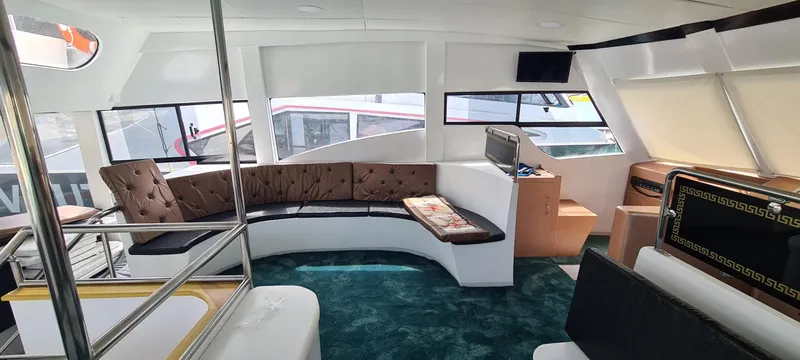  Yacht Photos Pics Luxurious interior of a 2021 Jetcraft passenger boat with plush seating and modern amenities.