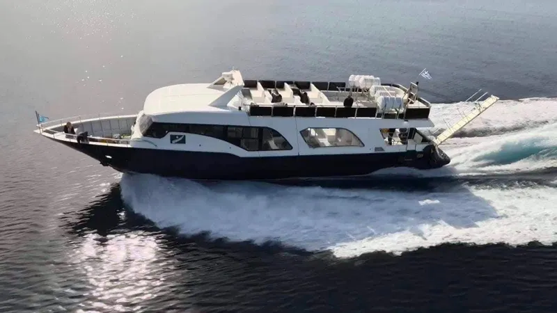  Yacht Photos Pics 2021 Jetcraft Passenger Boat cruising on calm waters, showcasing sleek design and modern features.