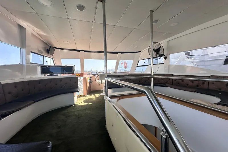  Yacht Photos Pics Interior of 2021 Jetcraft Passenger Boat with modern seating and panoramic windows.