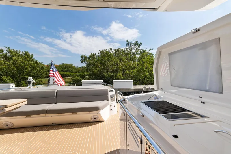 Jolly Rogers Yacht Photos Pics Sunseeker Predator 68 yacht deck with seating and grill, 2018 model.