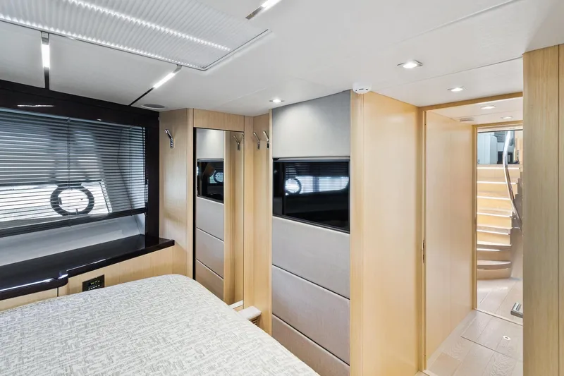 Jolly Rogers Yacht Photos Pics Luxurious interior of 2018 Sunseeker Predator 68 yacht, featuring modern design and elegant furnishings.
