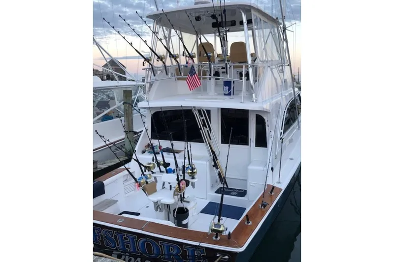 Offshore Obsession Yacht Photos Pics 1998 Ocean 53 Convertible yacht with fishing rods docked at marina.