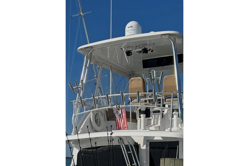 Offshore Obsession Yacht Photos Pics 1998 Ocean 53 Convertible yacht with fishing rods and American flag.