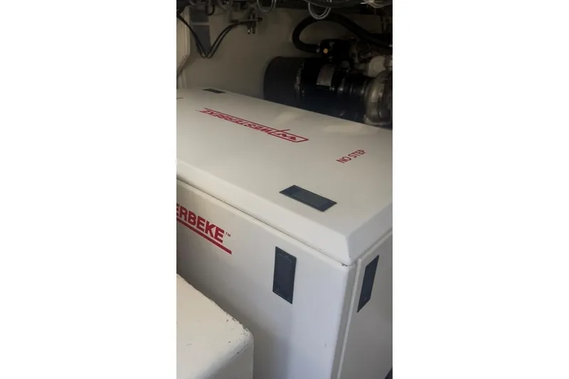 Offshore Obsession Yacht Photos Pics Engine room of 1998 Ocean 53 Convertible yacht with Westerbeke generator.