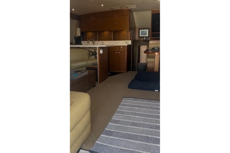 Offshore Obsession Yacht Photos Pics Interior of a 1998 Ocean 53 Convertible yacht with cozy seating and modern amenities.