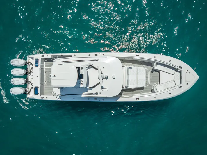  Yacht Photos Pics Aerial view of 2018 Everglades 435 Center Console boat on clear blue water.