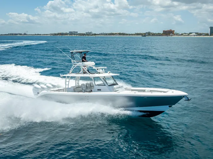  Yacht Photos Pics 2018 Everglades 435 Center Console boat cruising on open water.