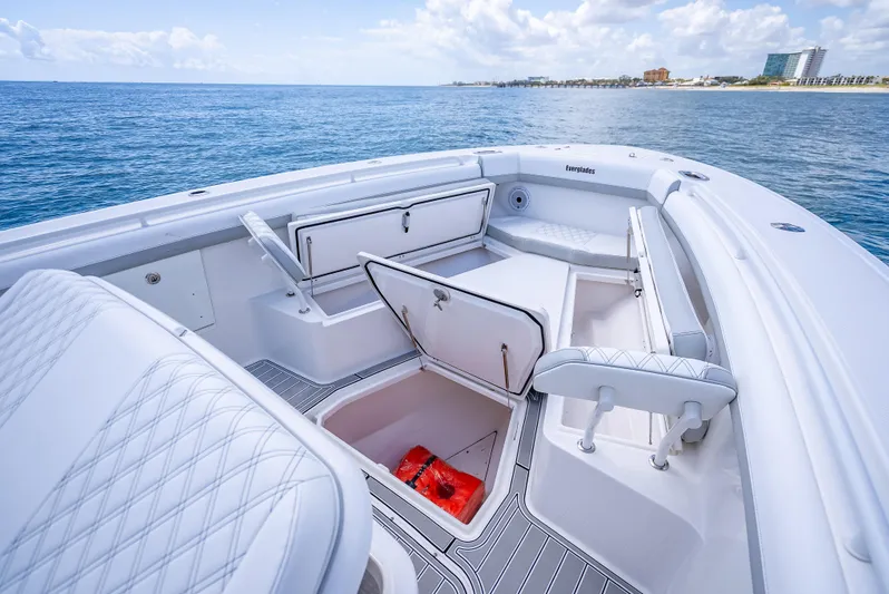  Yacht Photos Pics 2018 Everglades 435 Center Console boat interior with open storage compartments on calm ocean.