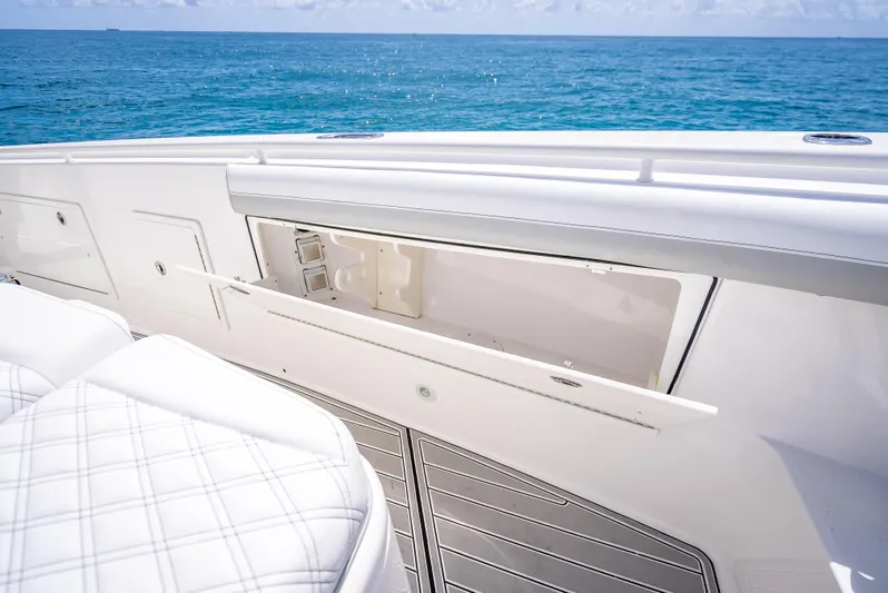  Yacht Photos Pics 2018 Everglades 435 Center Console boat with open storage compartment, ocean view.