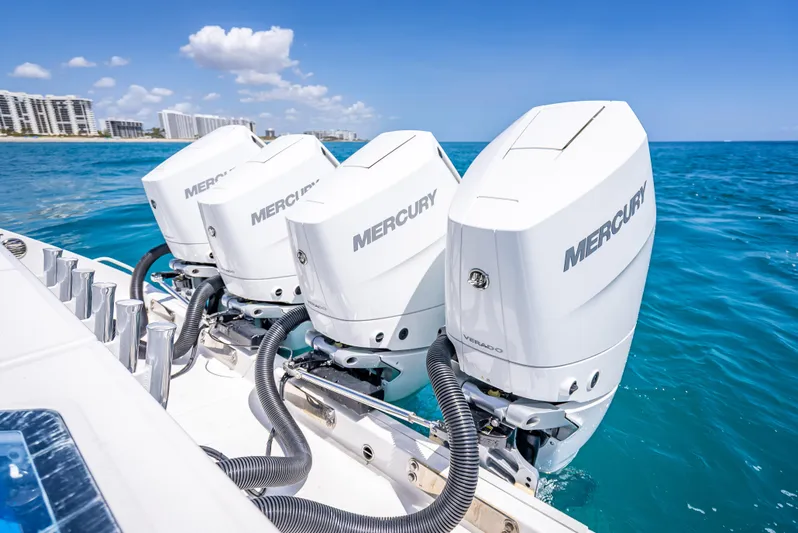  Yacht Photos Pics Four Mercury outboard engines on a 2018 Everglades 435 Center Console boat in blue ocean.