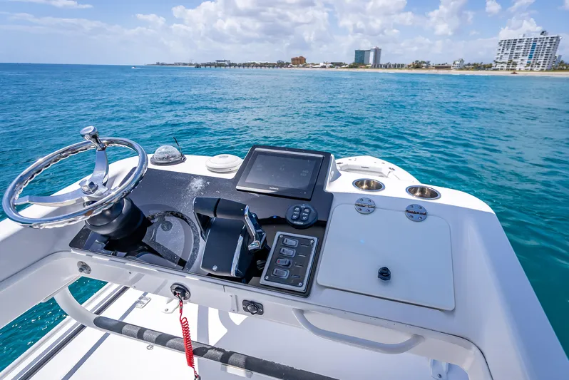  Yacht Photos Pics 2018 Everglades 435 Center Console helm with ocean view and modern controls.
