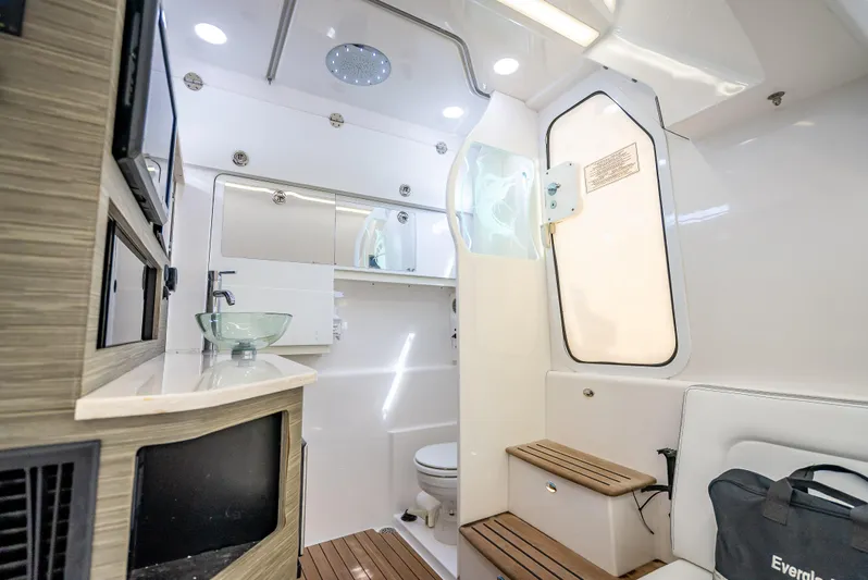  Yacht Photos Pics Luxurious interior of 2018 Everglades 435 Center Console boat with modern amenities.