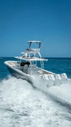  Yacht Photos Pics 2018 Everglades 435 Center Console boat cruising on open ocean waters.