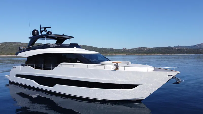 Victoria Yacht Photos Pics 2023 Cranchi Settantotto 78 yacht on calm water with scenic background.