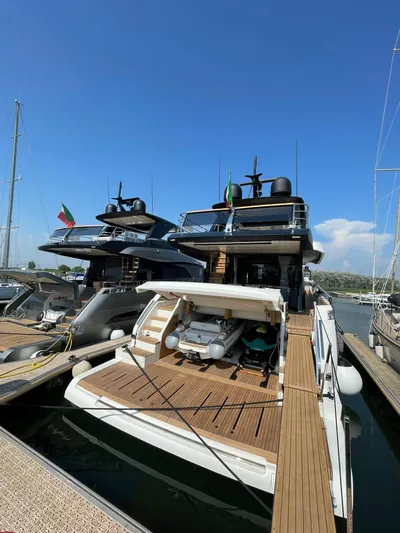 Victoria Yacht Photos Pics 2023 Cranchi Settantotto 78 yacht docked, showcasing luxurious design and spacious deck.