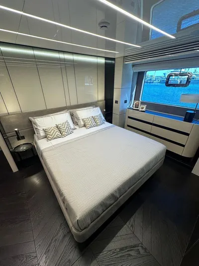Victoria Yacht Photos Pics Luxurious bedroom interior of 2023 Cranchi Settantotto 78 yacht with modern design and sea view.