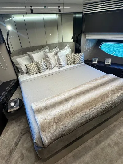 Victoria Yacht Photos Pics Luxurious bedroom interior of 2023 Cranchi Settantotto 78 yacht with elegant bedding and decor.