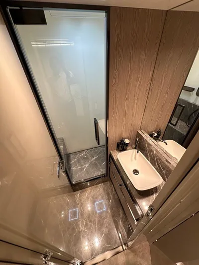Victoria Yacht Photos Pics Luxurious bathroom interior of 2023 Cranchi Settantotto 78 yacht with modern fixtures.