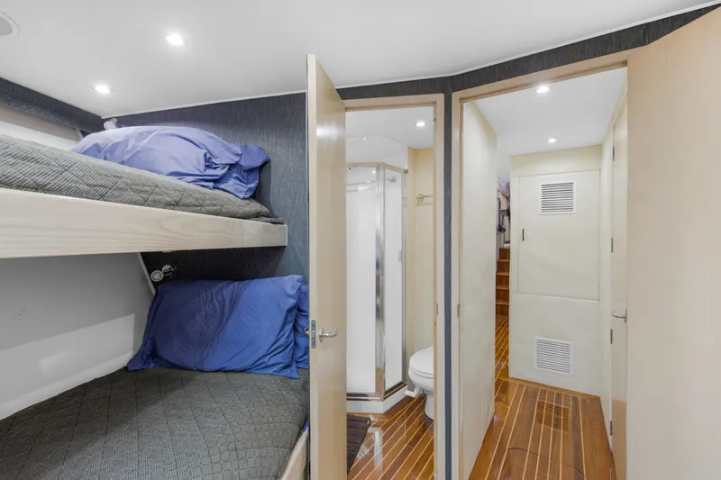 Fatso Yacht Photos Pics Interior of 1998 Hatteras 60 Convertible yacht with bunk beds and bathroom.