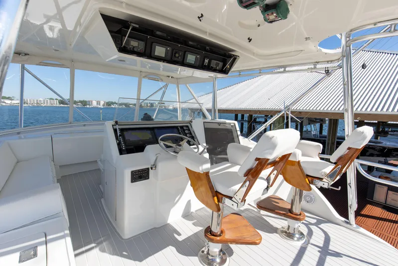 Fatso Yacht Photos Pics Cockpit of 1998 Hatteras 60 Convertible yacht with helm and seating.
