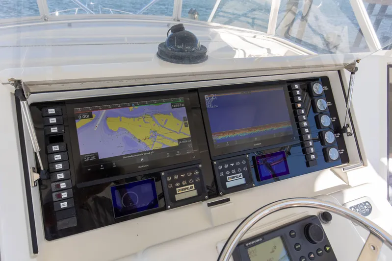 Fatso Yacht Photos Pics Navigation system on a 1998 Hatteras 60 Convertible yacht dashboard.