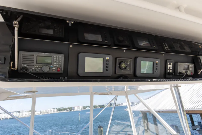Fatso Yacht Photos Pics Control panel of a 1998 Hatteras 60 Convertible yacht with navigation equipment.