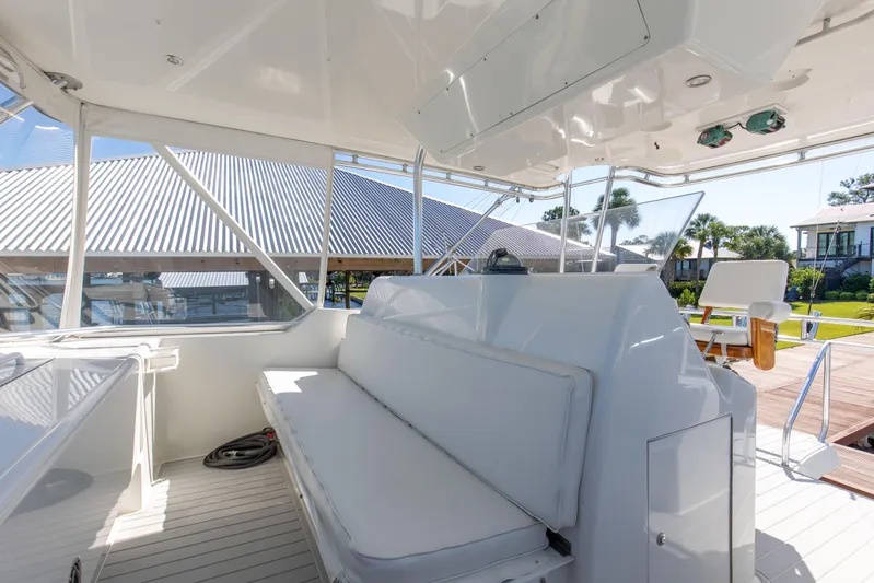 Fatso Yacht Photos Pics 1998 Hatteras 60 Convertible yacht interior with white seating and outdoor view.