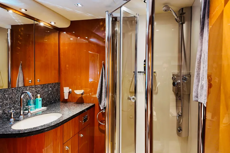 Samba Pa Ti Yacht Photos Pics Luxurious bathroom on 2004 Sunseeker 94 Yacht with elegant wood and granite finishes.