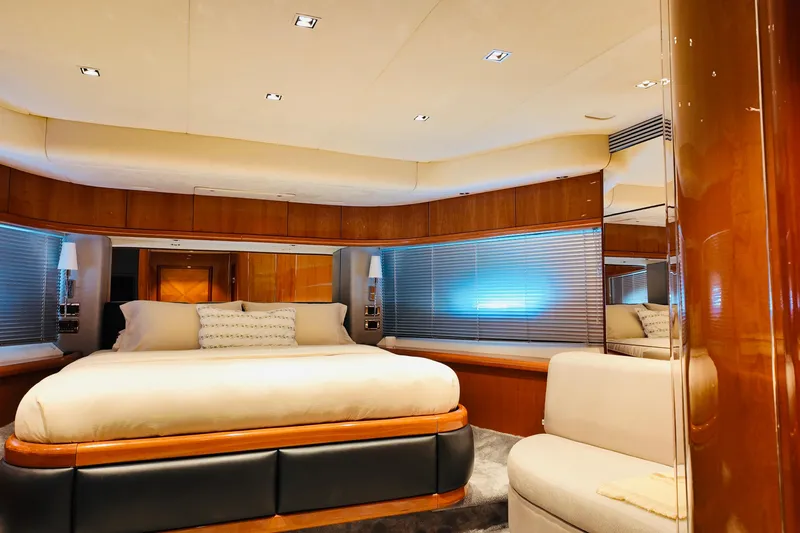 Samba Pa Ti Yacht Photos Pics Luxurious bedroom interior of 2004 Sunseeker 94 Yacht with elegant wood finishes.