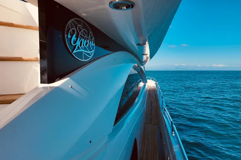 Samba Pa Ti Yacht Photos Pics 2004 Sunseeker 94 Yacht cruising on open sea under clear blue sky.