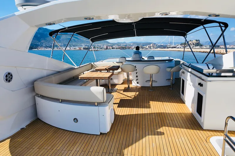 Samba Pa Ti Yacht Photos Pics Luxurious 2004 Sunseeker 94 Yacht deck with seating and ocean view.