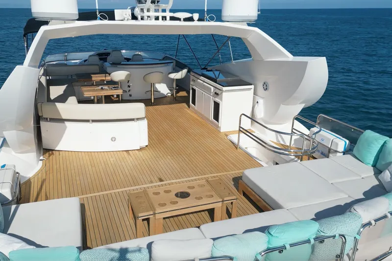 Samba Pa Ti Yacht Photos Pics Luxurious 2004 Sunseeker 94 Yacht deck with seating and ocean view.