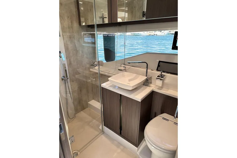  Yacht Photos Pics Luxurious bathroom in 2023 Galeon 460 Fly yacht with modern fixtures and ocean view.