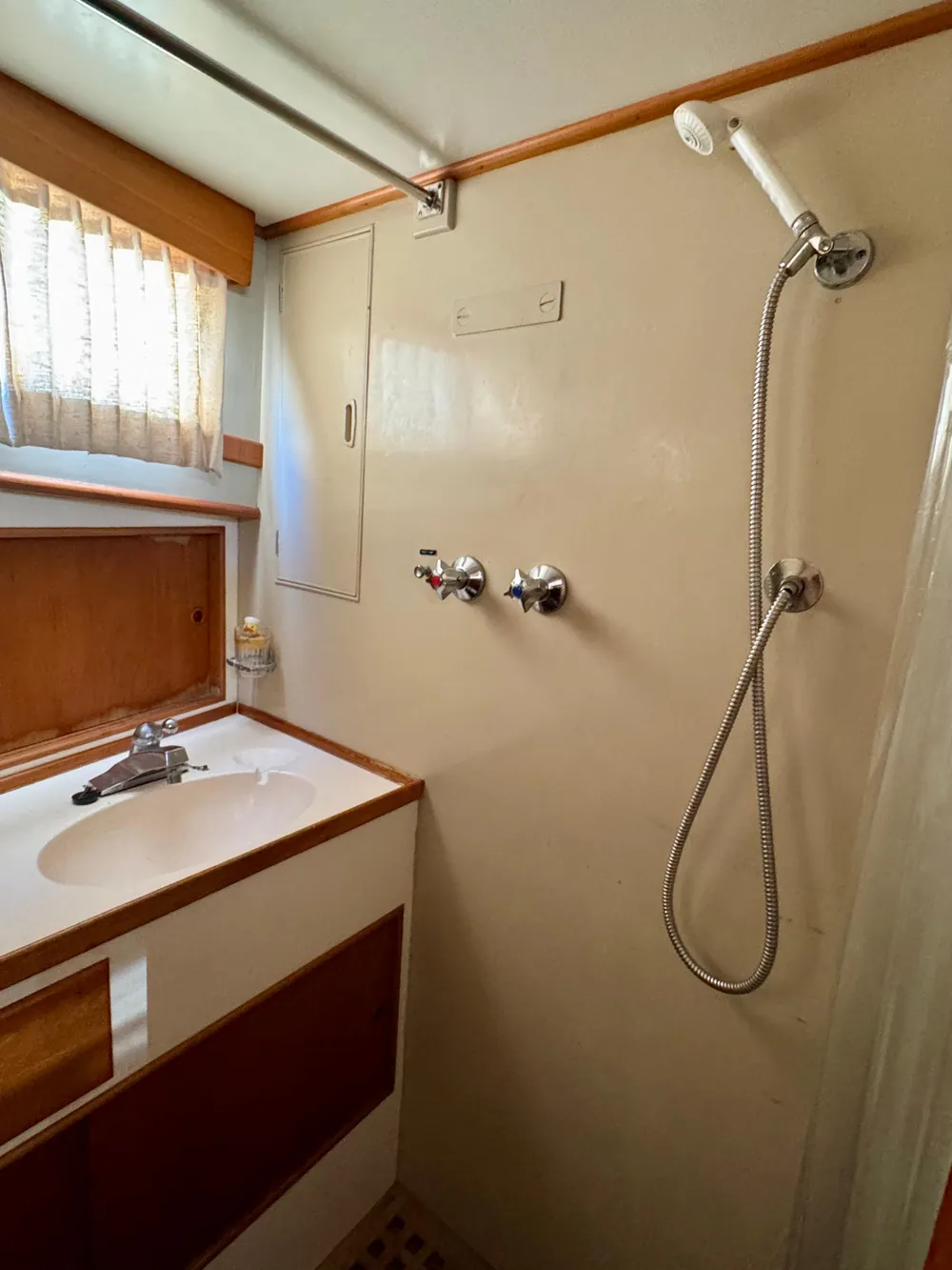 1979 Grand Banks Classic yacht bathroom with shower and sink.