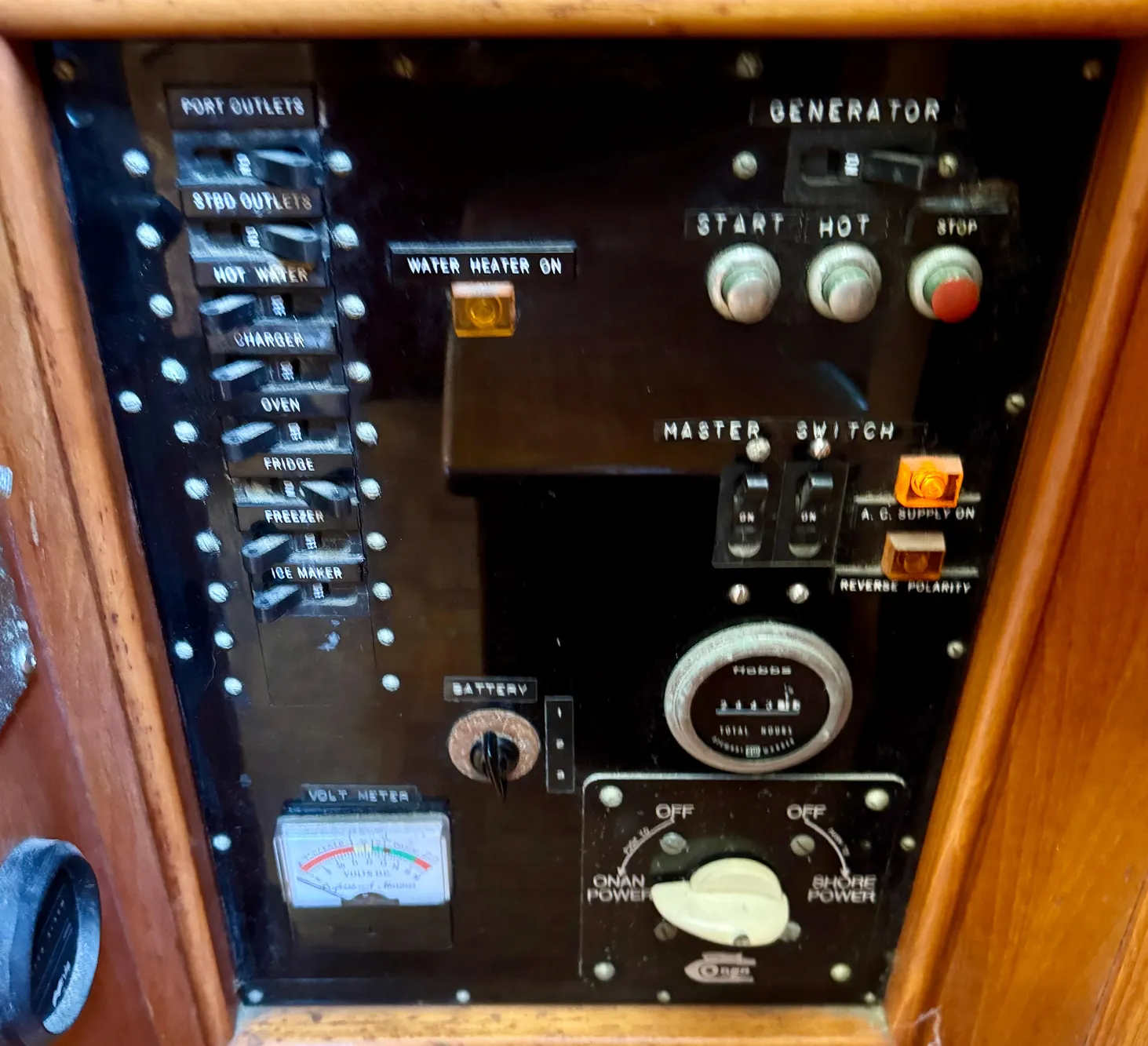 1979 Grand Banks Classic control panel with generator and power switches.