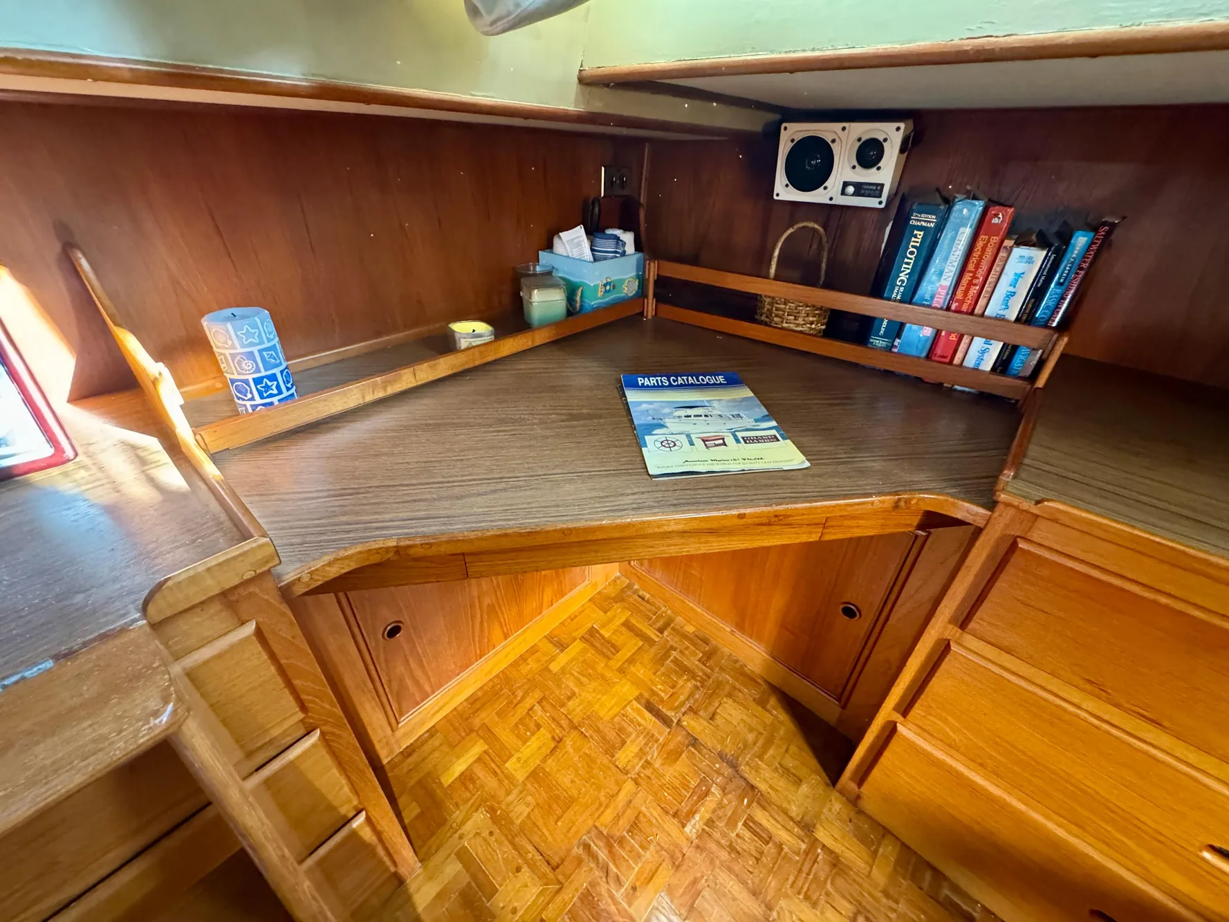 1979 Grand Banks Classic boat interior with wooden desk and bookshelves.