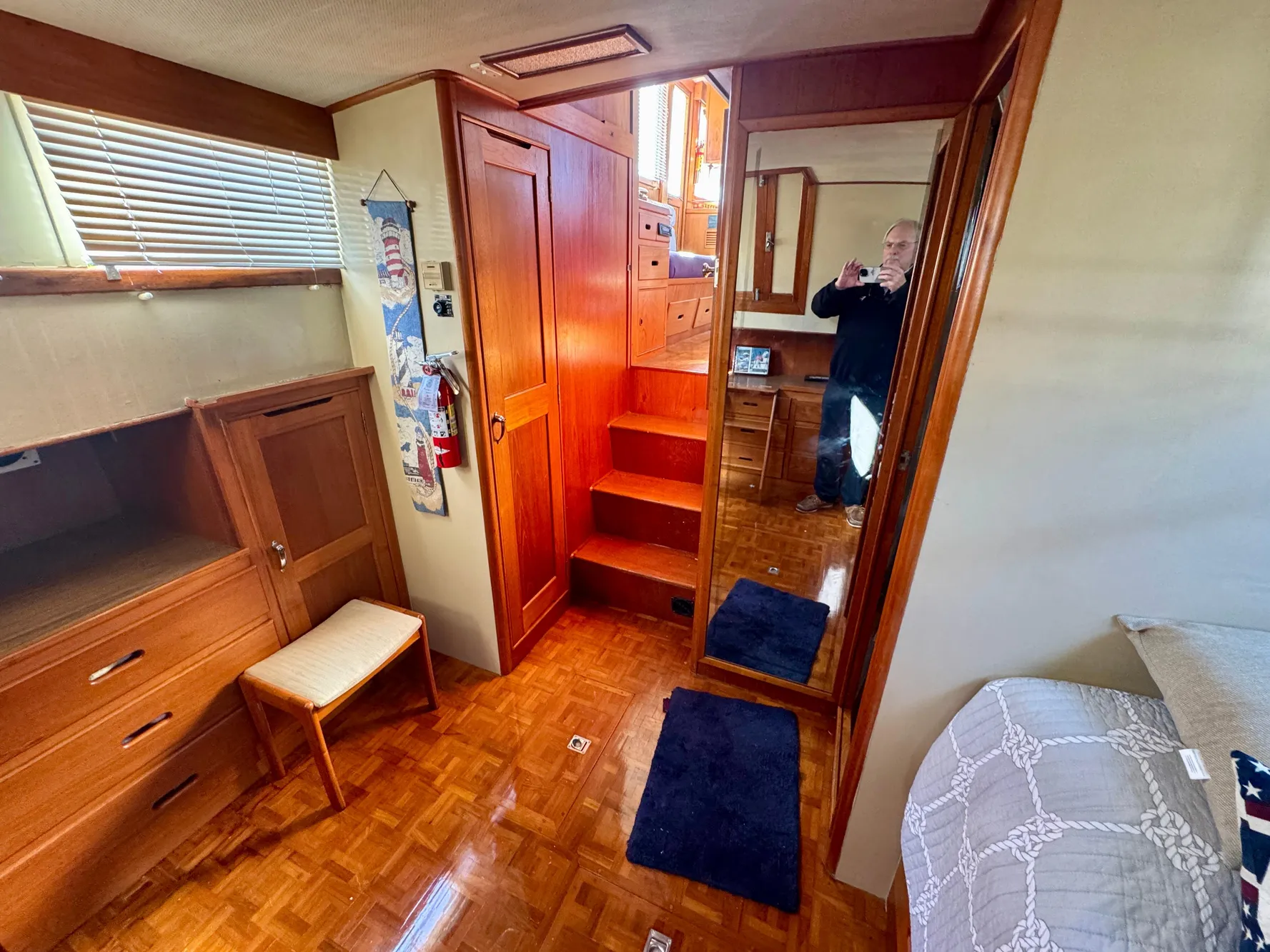 Interior of 1979 Grand Banks Classic yacht with wooden furnishings and cozy decor.