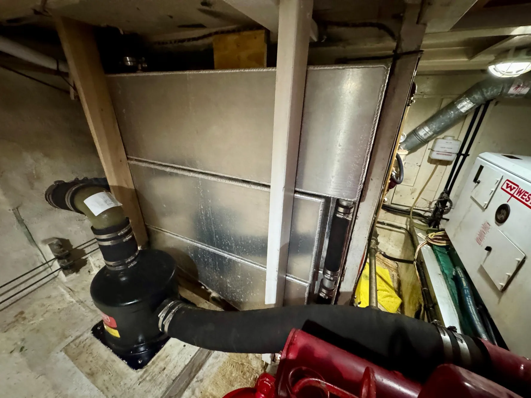 Engine room of 1979 Grand Banks Classic boat with visible machinery and equipment.
